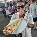 Dodgin the heat under the grandstands, eating a giant terrible slice of pizza from Bacci
